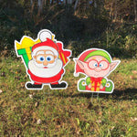 Load image into Gallery viewer, Santa Claus with Elf Yard Decoration  |  Christmas Lawn Decor  |  Santa Lawn Sign  |  Elf Lawn Sign  |  Full Color Print  |  Single-Sided  |  Holiday
